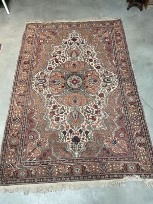 a large oriental rug on the floor in a room