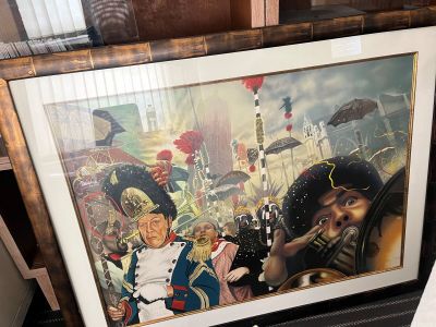 tableau représentant un homme en uniforme militaire tenant une cigarette devant le portrait d'un homme en uniforme militaire