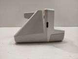 a close up of a white mouse on a table