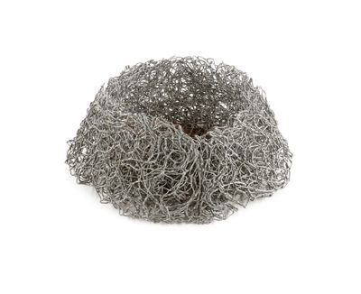 an image of a pile of wire mesh on a white surface