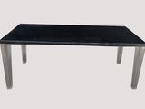 a black table with a glass top on a white background
