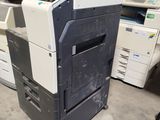 a printer that is sitting on the floor in a room