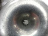 a close up of a metal object with a hole in it