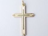 a gold cross on a white background