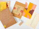 many different types of cards and envelopes laid out on a table