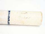 a roll of paper with writing on it sitting on a table