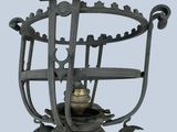 a lamp that is sitting on a pole with a bird on it