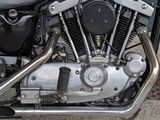a close up of a motorcycle parked on the side of the street