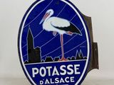 a blue sign with a white stork on top of it