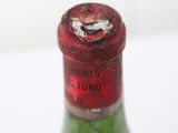 a bottle of wine that is sitting on a table
