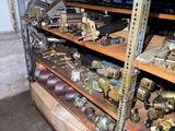 many different types of tools on the shelves in the garage