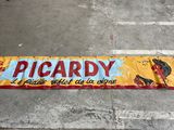 a sign that says picardy on the side of the road