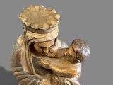 a statue of a woman holding a baby in her arms