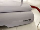 a close up of a white printer on a table