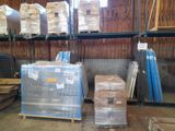 many pallets of boxes in a warehouse with pallets on them