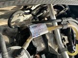a close up of a car ' s engine with a tag attached to it