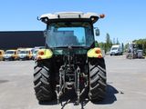 a tractor that is parked in a parking lot