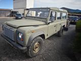 an old land rover is parked in a parking lot