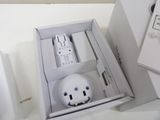 a white box with a remote control inside of it