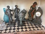 a lot of statues that are sitting on a table
