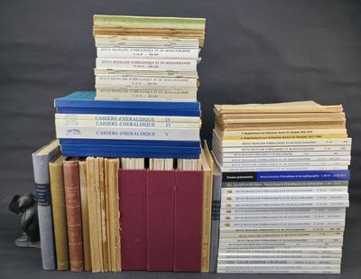 several books stacked on top of each other on a table