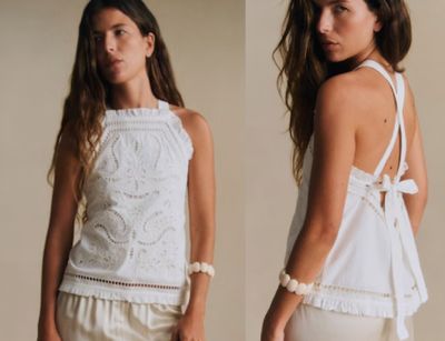 a woman that is wearing a white top and shorts