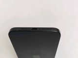 a close up of a black iphone on a white surface