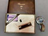 a close up of a box with a watch and a watch on it