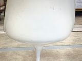 a white chair that is sitting in a room