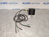 a picture of a black and white photo of an electrical device on a table