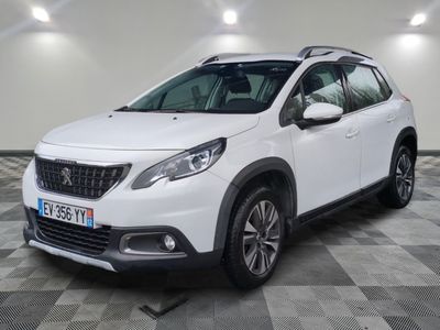 a white car is parked in a room with a checkered floor