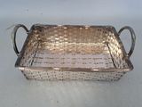 a silver tray with a handle on a table