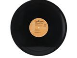 the record is black and has a yellow label on it