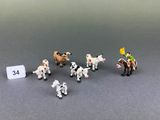 a lot of small toy animals that are on a table