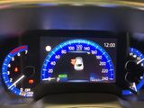 the dashboard of a car with a digital display showing the speed of the car