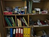 a book shelf with many files and folders on it