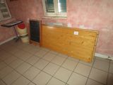 a small kitchen with a table and a refrigerator in it