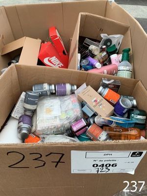 a cardboard box filled with assorted items on the street