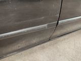 a close up of a car door with the door handle missing