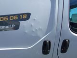 a white truck with a sticker on the side of it