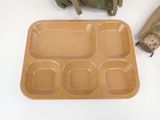 a brown tray with six compartments on a table