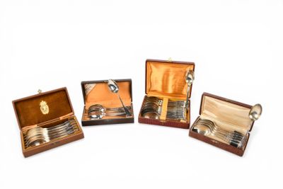 several silverware items are in a wooden case on a white surface