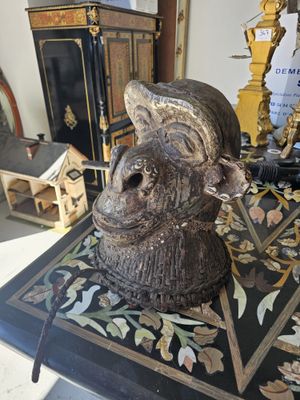 a statue of a man with a hat on top of a table
