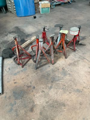 a lot of tools sitting on the floor in a garage