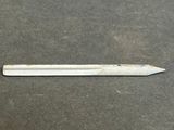 a close up of a pencil laying on top of a table