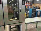 an image of a large machine in a warehouse with a lot of machines