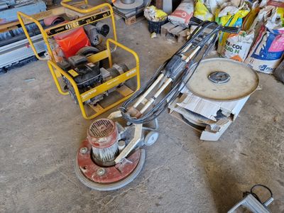 une machine posée à même le sol dans un garage