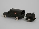 a black toy truck with a tank attached to it