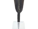 an image of a metal object on a clear stand