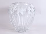 a clear glass vase that is sitting on a table